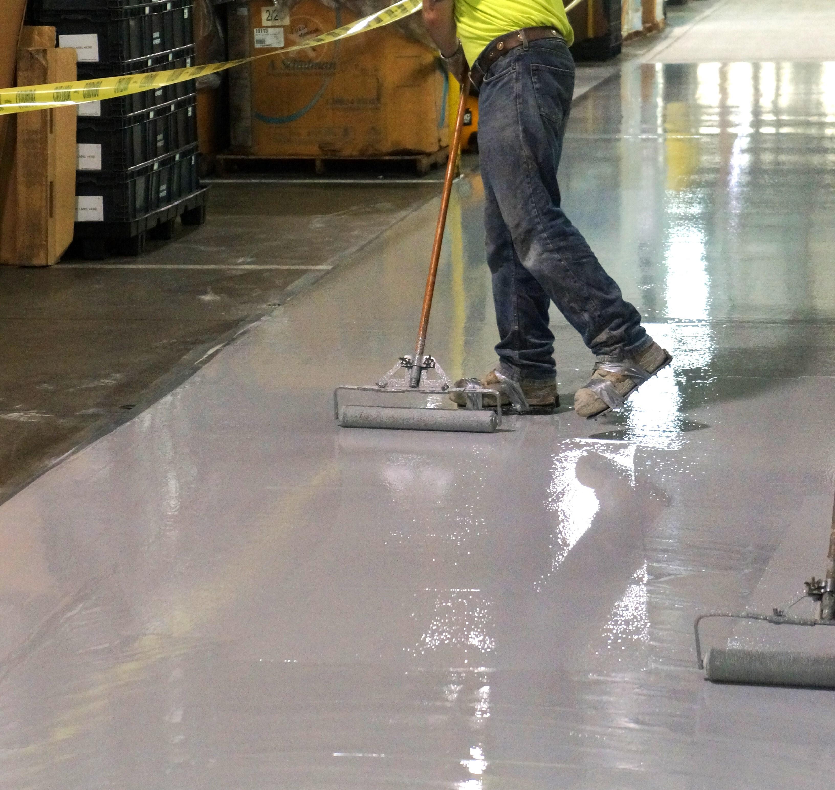 using a roller to apply epoxy floor coating