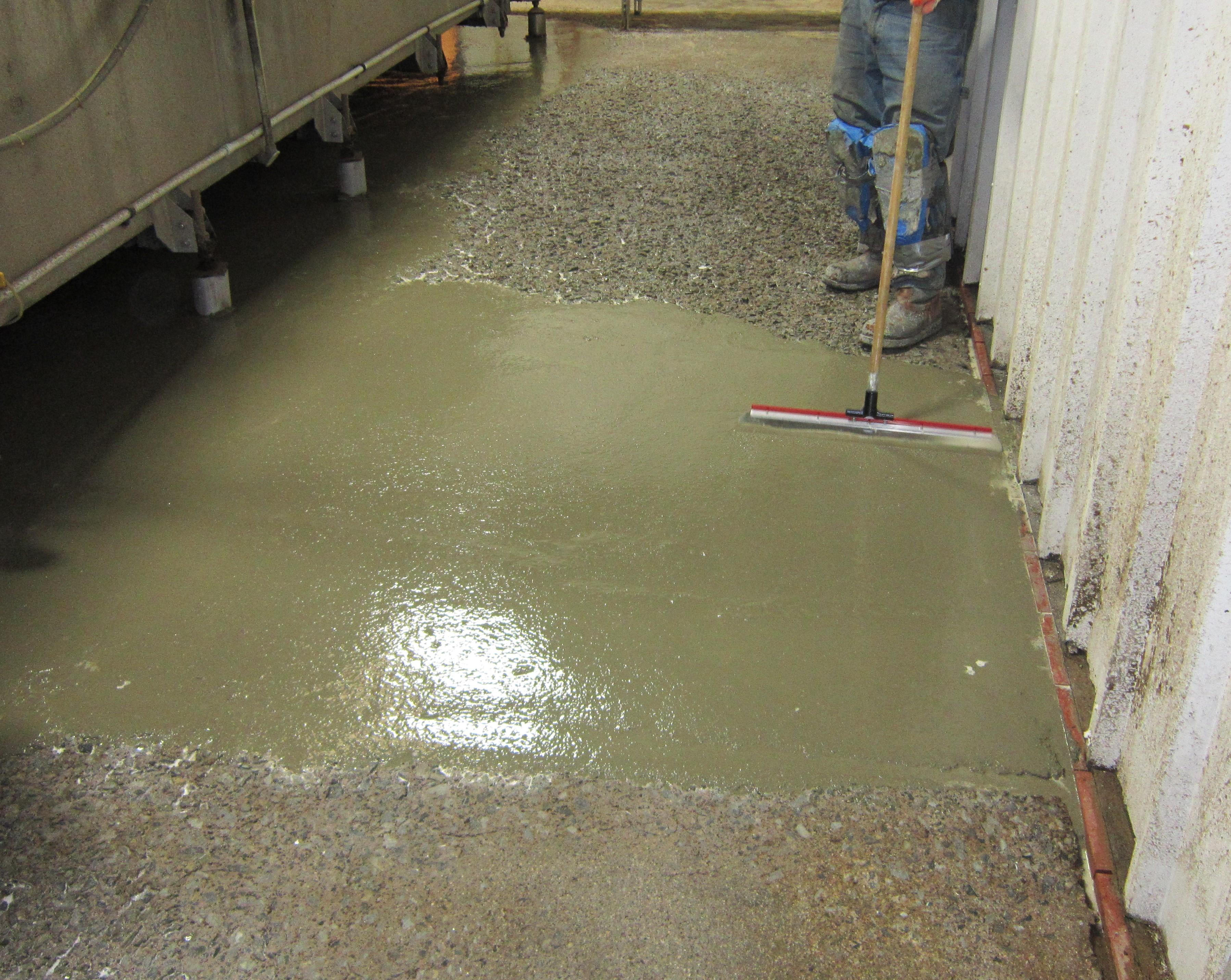 spreading pourable concrete