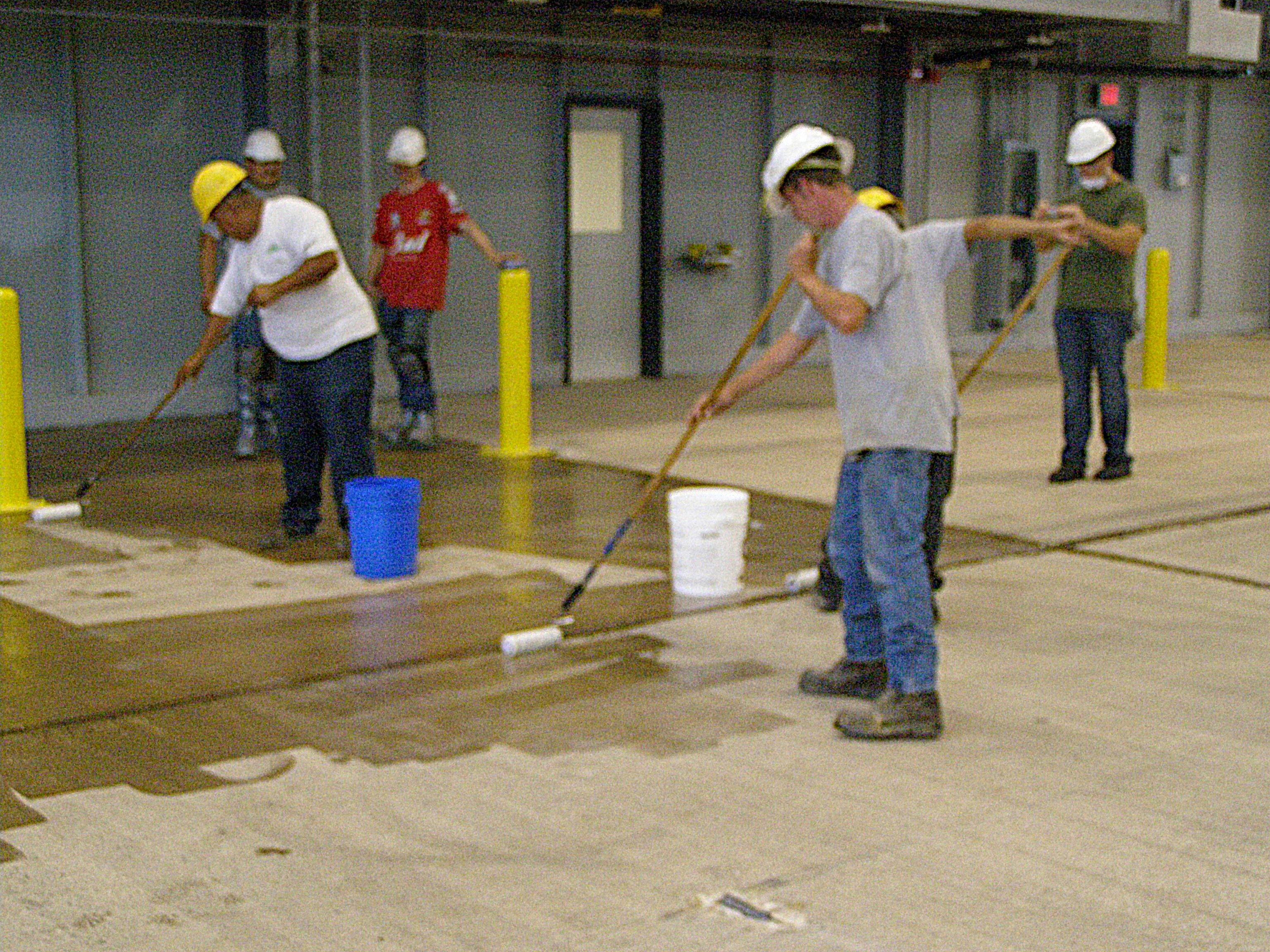 using a roller to apply epoxy primer