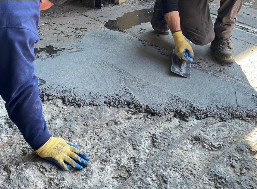 Applying epoxy mortar to repair damaged industrial concrete