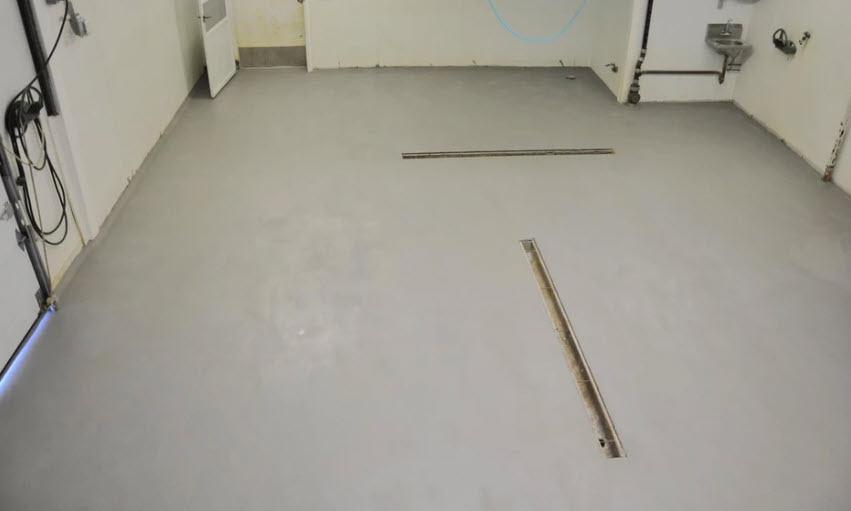 Repaired and resurfaced concrete floor in an industrial facility